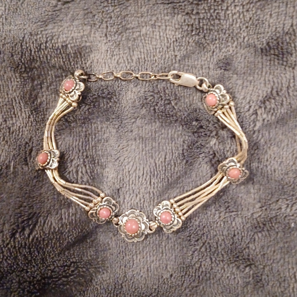 Rhodonite and sterling silver bracelet.8 1/2 inches. 7 stations of Rhodonite.